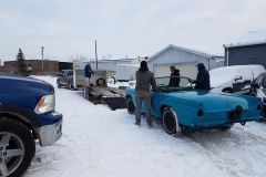 1956 Ford T-bird custom painted Peacock blue is loaded up on a trailer to go home