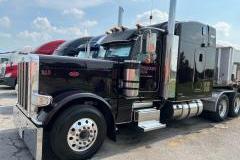 Outside view of a Peterbuilt truck with painted parts
