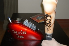 We really will paint anything!  This motorcycle tank now displays our business cards and that donated prosthetic leg got a cool design.