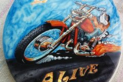 A toilet seat lid with the words "Loud and Alive"... there's gotta be a joke there!