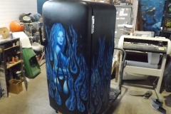 Cool blue flames frame a ghostly woman on this full size Admiral fridge