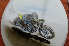 Another toilet seat lid, this one with a racing motorcycle
